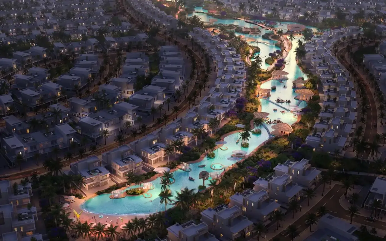 DAMAC Islands 2 aerial render at night, villas around a lit lagoon, AED 11 billion sold within hours of launch